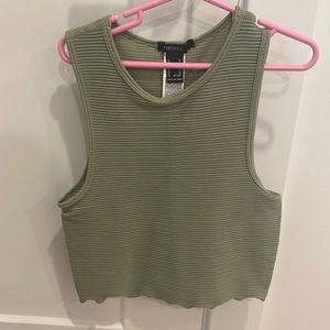 Green ribbed tank top. Ruffles on the end